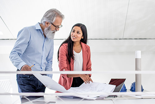 A woman presenting at a conference