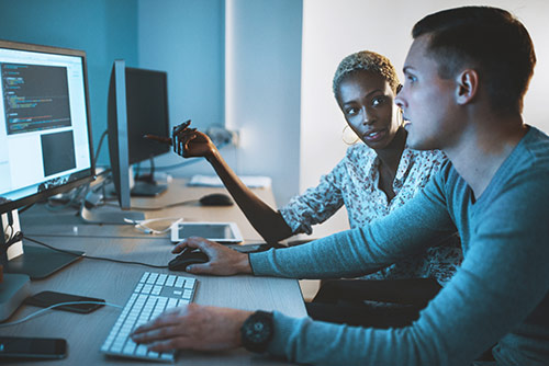 A woman presenting at a conference