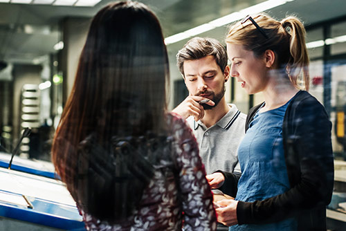 A woman presenting at a conference