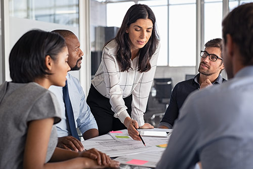 A woman presenting at a conference